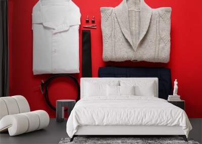 Stylish male clothes and accessories on red background Wall mural