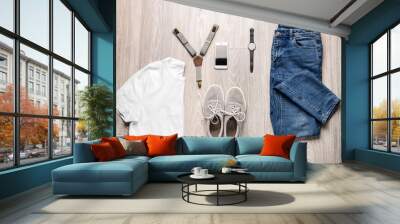 Stylish male clothes with accessories and mobile phone on wooden background Wall mural