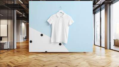 Stylish shirt hanging on color background Wall mural