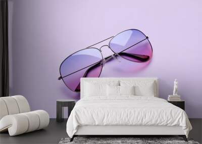 Stylish sunglasses on color background Wall mural