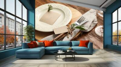 Stylish table setting with blank card on wooden table, closeup Wall mural