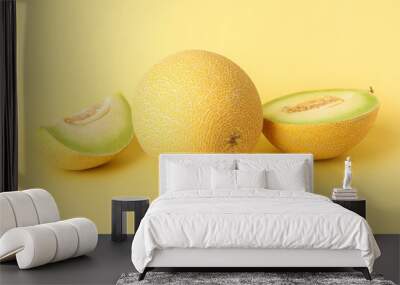 Sweet melon with pieces on yellow background Wall mural