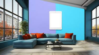 Tablet computer on color background Wall mural