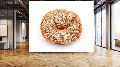 Tasty bagel with sesame and pumpkin seeds on white background Wall mural