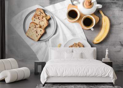 Tasty banana bread with coffee on grey table Wall mural