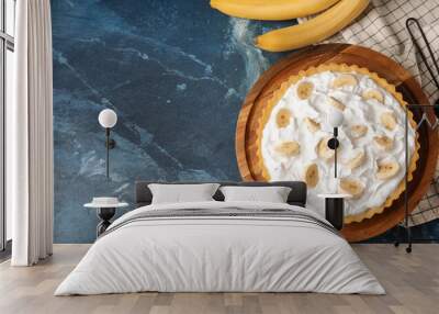 Tasty banana cake on dark blue background with space for text Wall mural