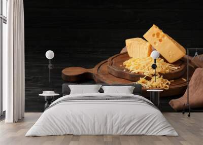 Tasty cheese on dark wooden background Wall mural