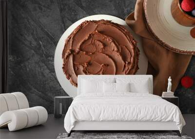 Tasty chocolate cake on grunge background Wall mural