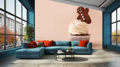 Tasty Christmas cupcake with gingerbread cookie on beige background Wall mural