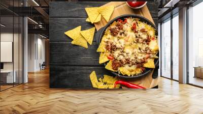 Tasty Mexican dish with nachos on table Wall mural