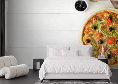 Tasty pizza on white wooden background with space for text Wall mural