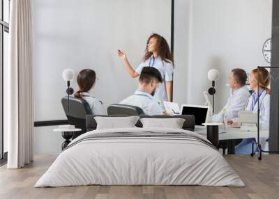 Team of doctors during meeting in modern clinic Wall mural