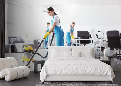 Team of janitors cleaning office Wall mural