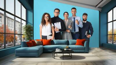 Team of young business people on blue background Wall mural