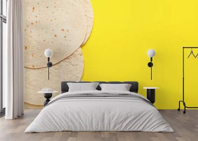 Thin lavash on yellow background Wall mural