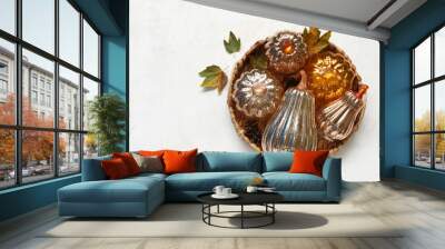 Tray with decorative pumpkins and autumn leaves on white background Wall mural