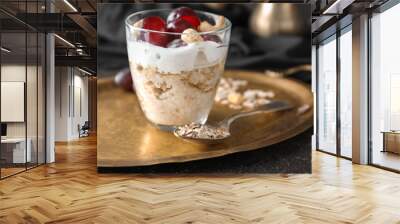 Tray with tasty oatmeal dessert in glass on table, closeup Wall mural