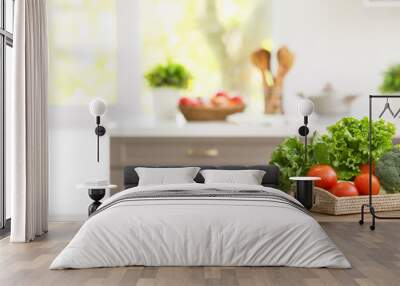 Tray with vegetables on table in modern kitchen Wall mural