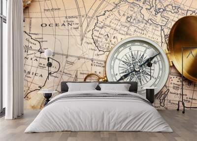 Vintage compass with sea shells on world map. Travel concept Wall mural