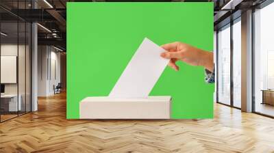 Voting woman near ballot box on color background Wall mural