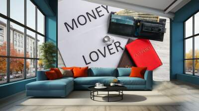 Wedding rings, wallet with dollars, passports and card with text MONEY LOVER on table. Marriage of convenience Wall mural