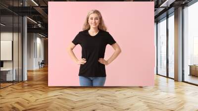 Woman in stylish t-shirt on color background Wall mural