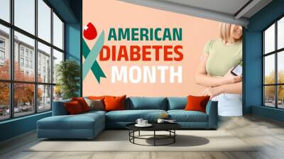 Woman with glucose sensor and mobile phone measuring blood sugar level on beige background. Banner for American Diabetes Month Wall mural