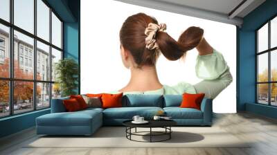 Woman with ponytail and silk scrunchy on white background Wall mural