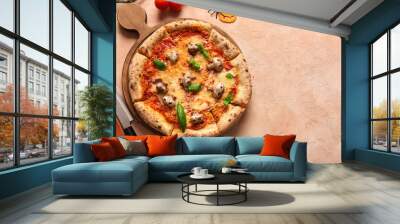 Wooden board of tasty pizza with mushrooms and spiders for Halloween celebration on beige background Wall mural