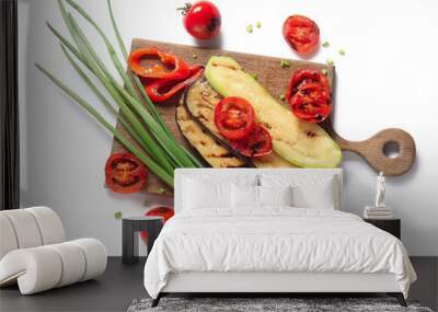 Wooden board with different tasty grilled vegetables on white background Wall mural