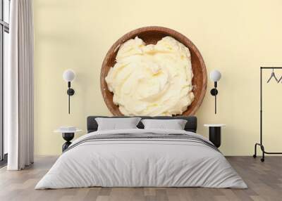 Wooden bowl with fresh butter on color background Wall mural