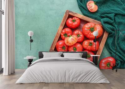 Wooden box with fresh tomatoes on green background Wall mural