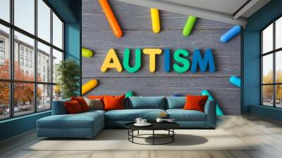 Word AUTISM and chalks on dark wooden background Wall mural