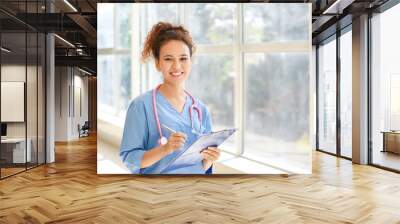 Young African-American nurse in clinic Wall mural