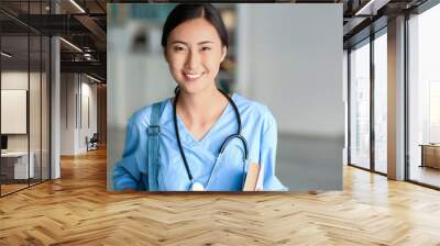 Young Asian student in clinic Wall mural