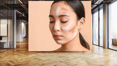 Young Asian woman with contouring makeup on color background Wall mural