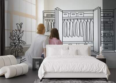 Young couple thinking about design of their new flat Wall mural