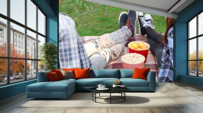 Young couple watching movie in outdoor cinema Wall mural