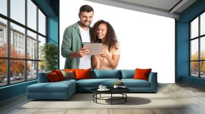 Young couple with tablet computer on white background Wall mural