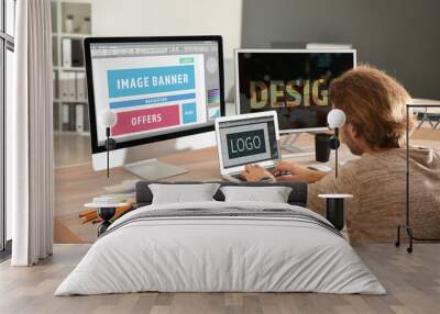 Young designer working in studio Wall mural