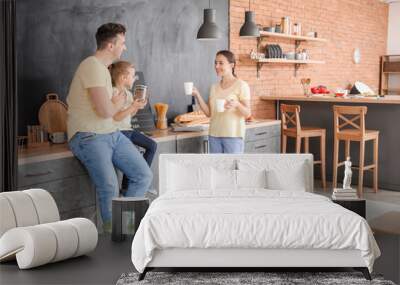 Young family in kitchen at home Wall mural