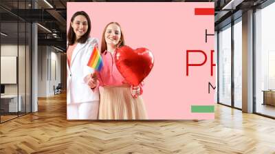 Young lesbian couple with word LOVE made of balloons and LGBT flag on pink background. Valentine's Day celebration Wall mural