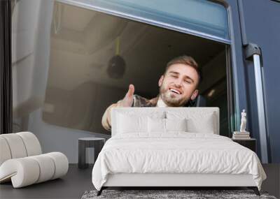 Young man driving modern truck Wall mural