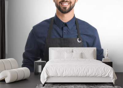 Young man wearing apron on white background Wall mural