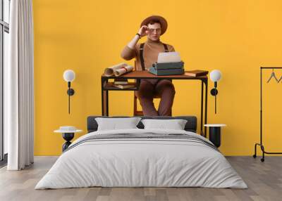 Young man with vintage typewriter at table on yellow background Wall mural