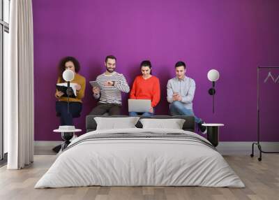 Young people waiting for job interview indoors Wall mural