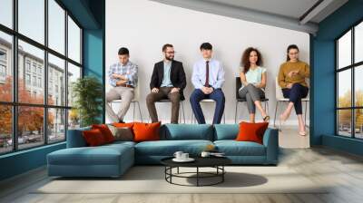 young people waiting for job interview indoors Wall mural