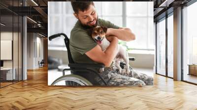 Young soldier in wheelchair with dog at home Wall mural