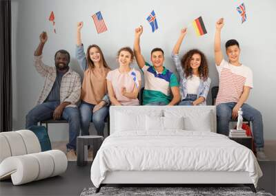 Young students of language school near color wall Wall mural