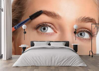 Young woman undergoing eyebrow correction procedure, closeup Wall mural